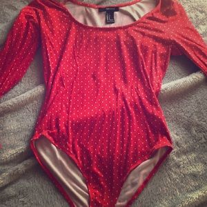 Polka dot body suit with flared arms